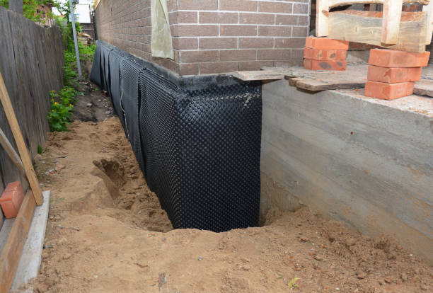 Happy homeowners after waterproofing job in Allegan